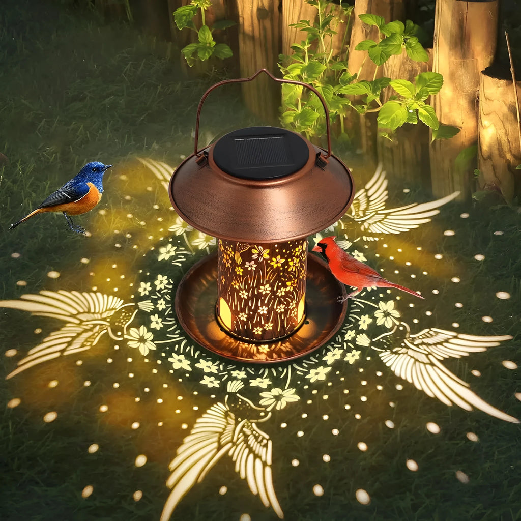 Solar-powered iron art bird feeder with hummingbird pattern and integrated LED light for gardens