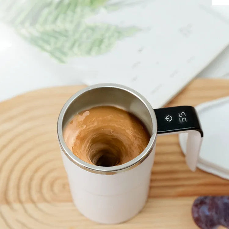 White electric automatic magnetic stirring mug with LCD temperature display on black base