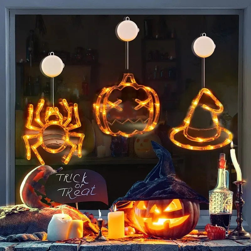 Halloween window hanging LED lights set with seven plastic decorations including spider, pumpkin, and ghost designs