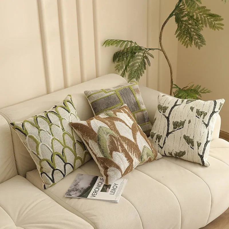 Square 45cm retro jacquard cushion cover with a woven plants and flowers pattern in a Nordic style, shown in one of eight available colours.