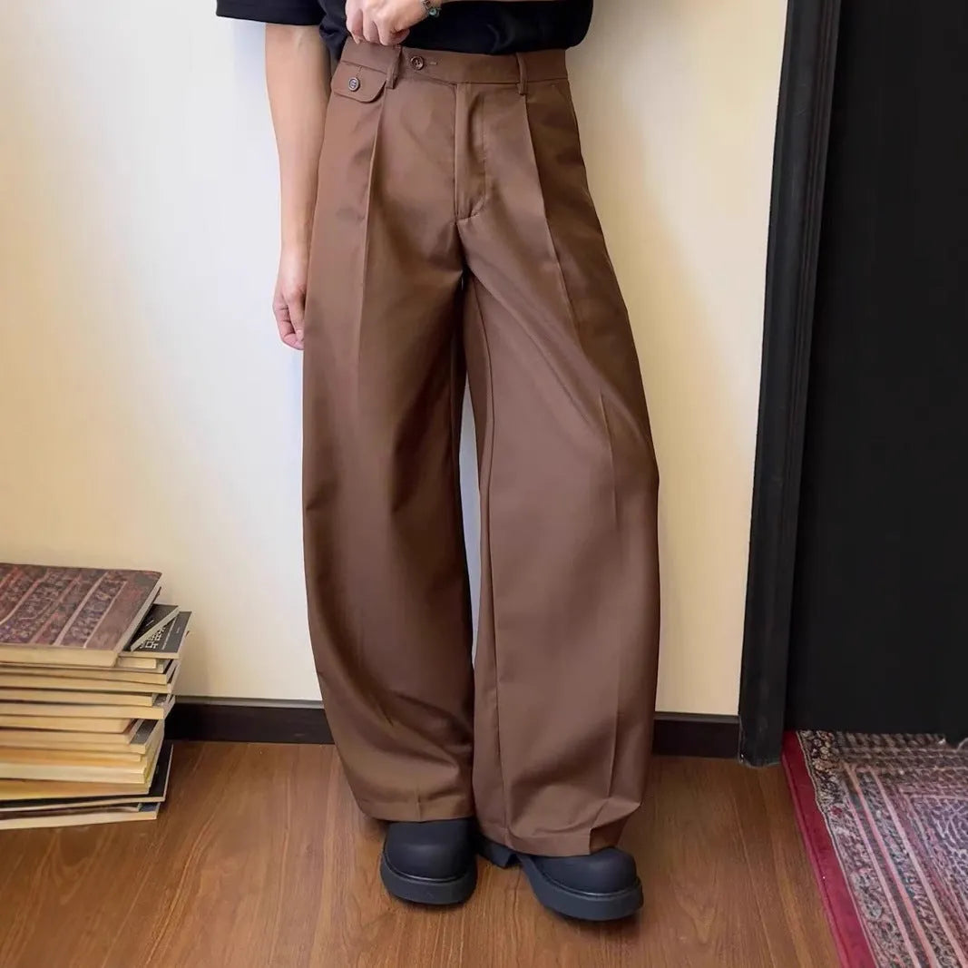 Brown men's wide-leg straight trousers with a draping casual suit style on a hanger.