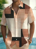 Man wearing a loose-fit cardigan shirt with a retro geometric square print in contrasting colours.