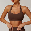 Halter neck sports bra for women in nylon, shown in plum purple colour.