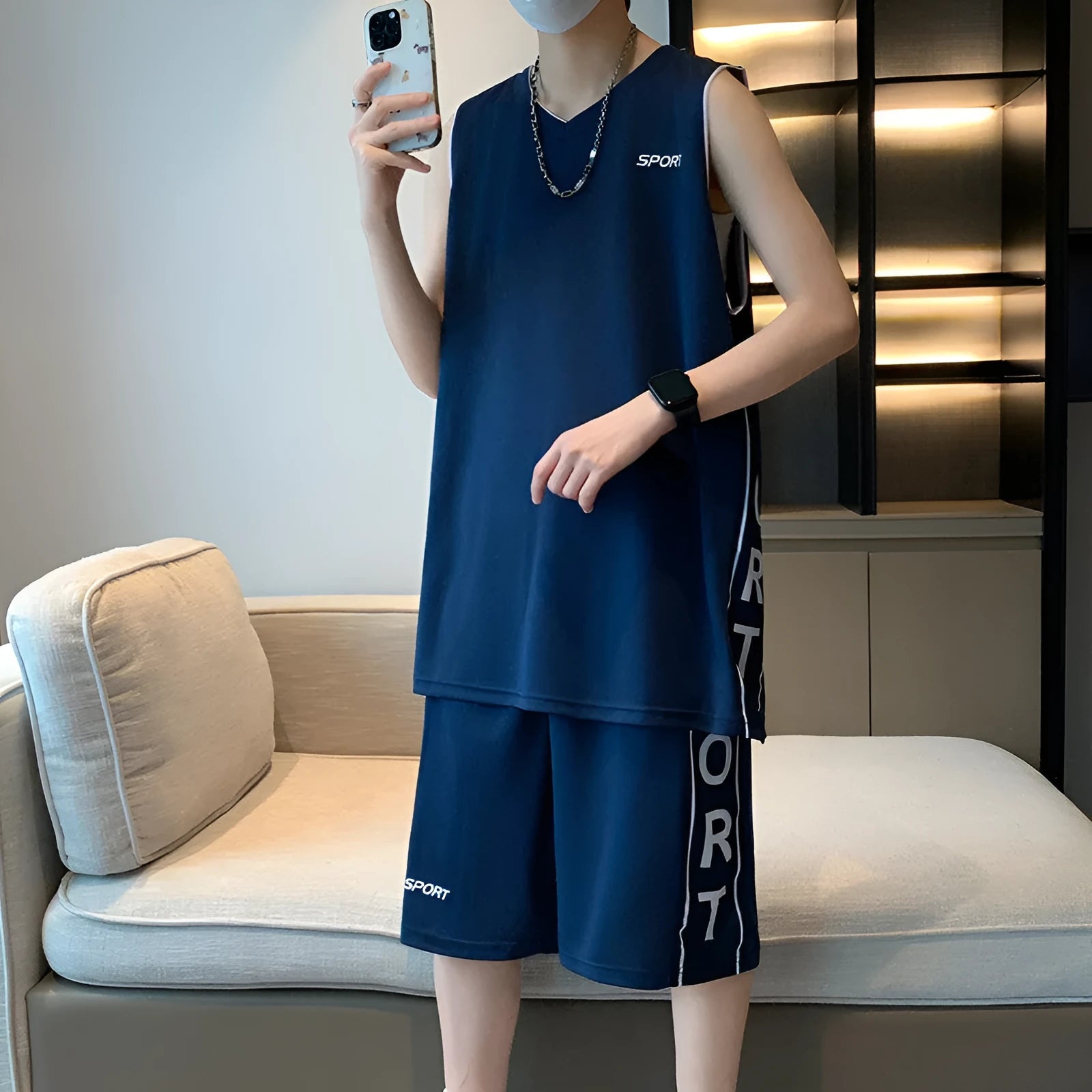 Basketball sports suit comprising sleeveless vest and matching shorts in polyester fabric