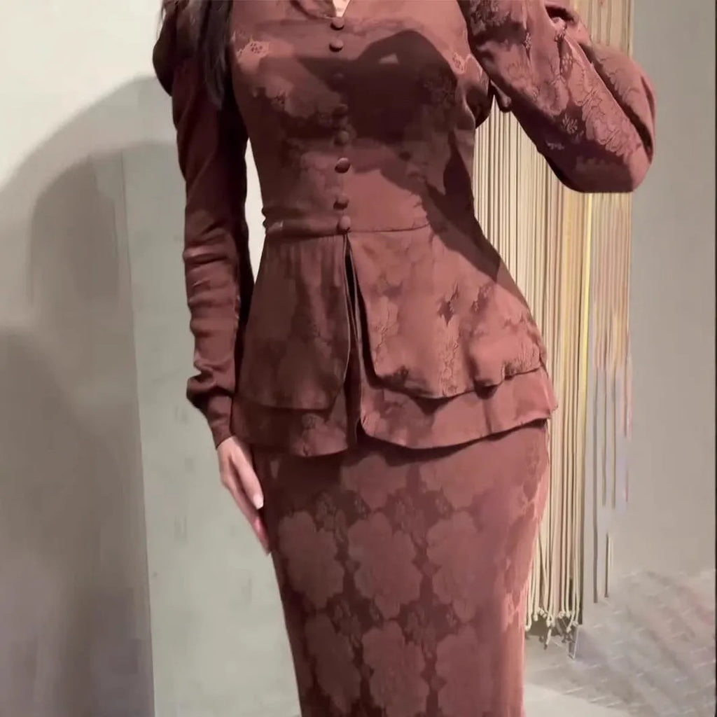 Dark brown retro floral print long sleeve women's dress with button details on a mannequin.