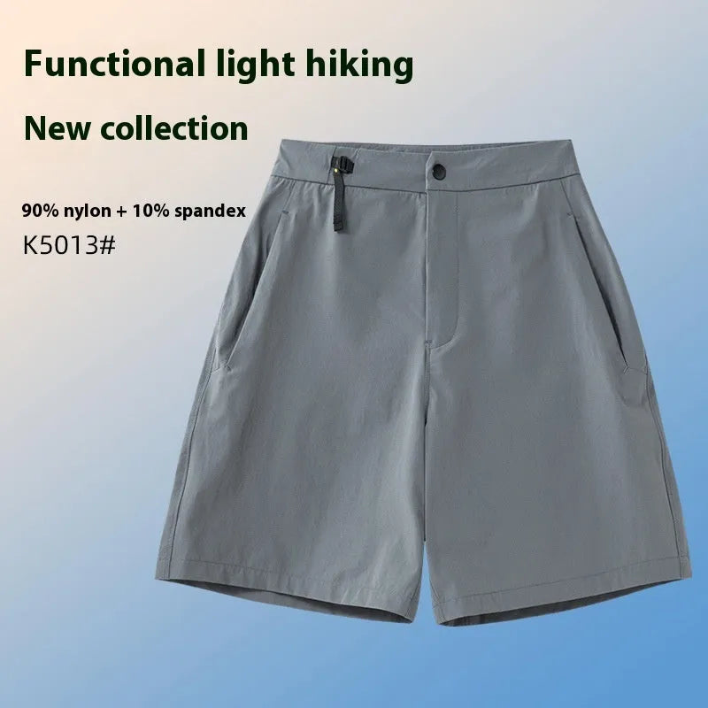 Men's quick-drying sports shorts in khaki colour with 3D cut and elastic waistband on a plain background.