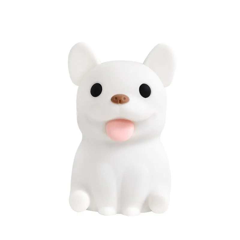 Silicone animal-shaped USB night light with touch dimming on a bedside table.