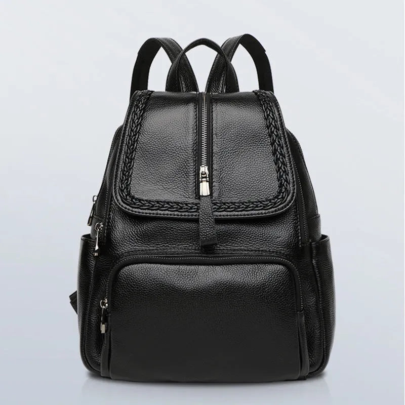 Blue genuine leather street trend women's backpack showing external sandwich pocket and zipper.