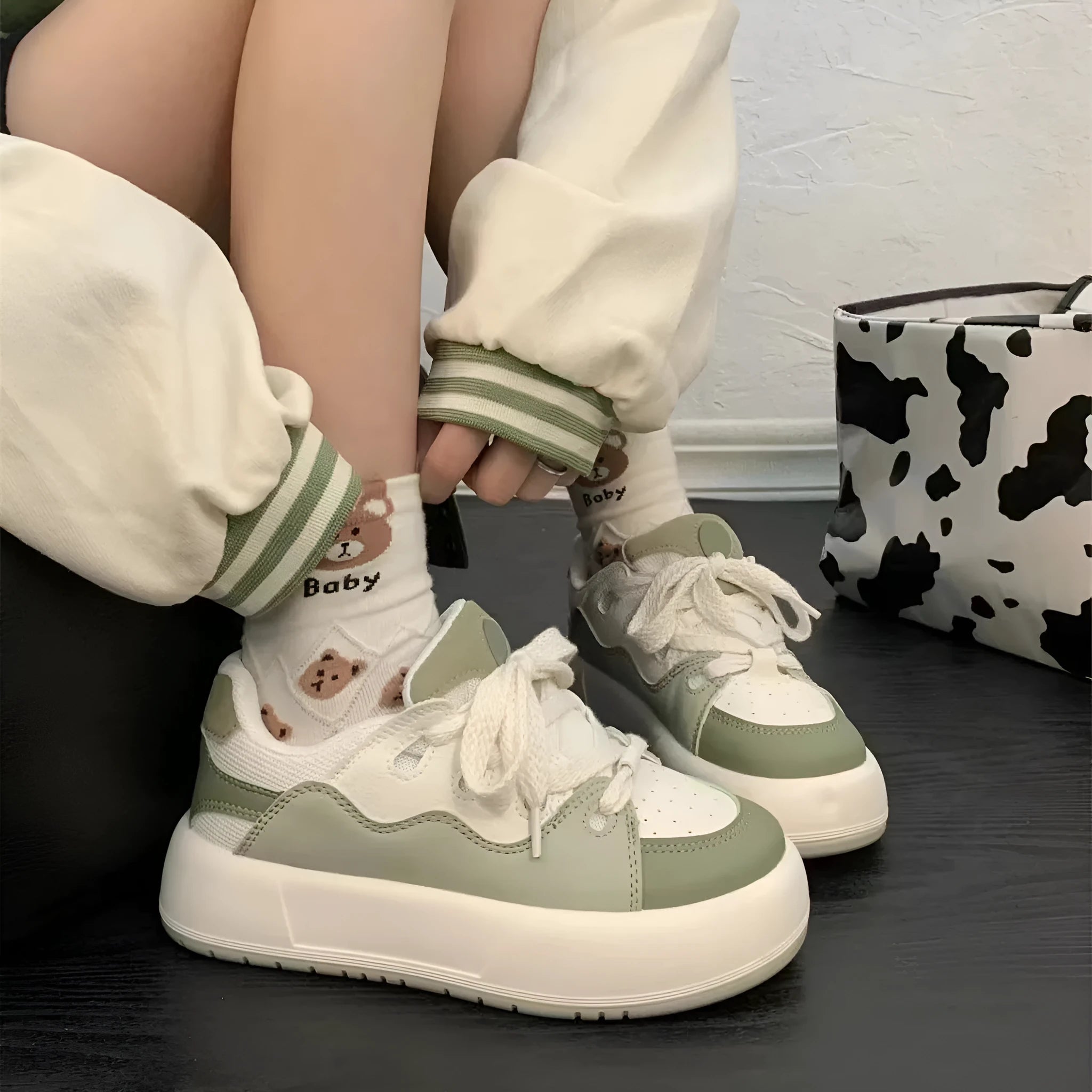 Green women's casual shoes with mesh upper, flat heel, and round toe design