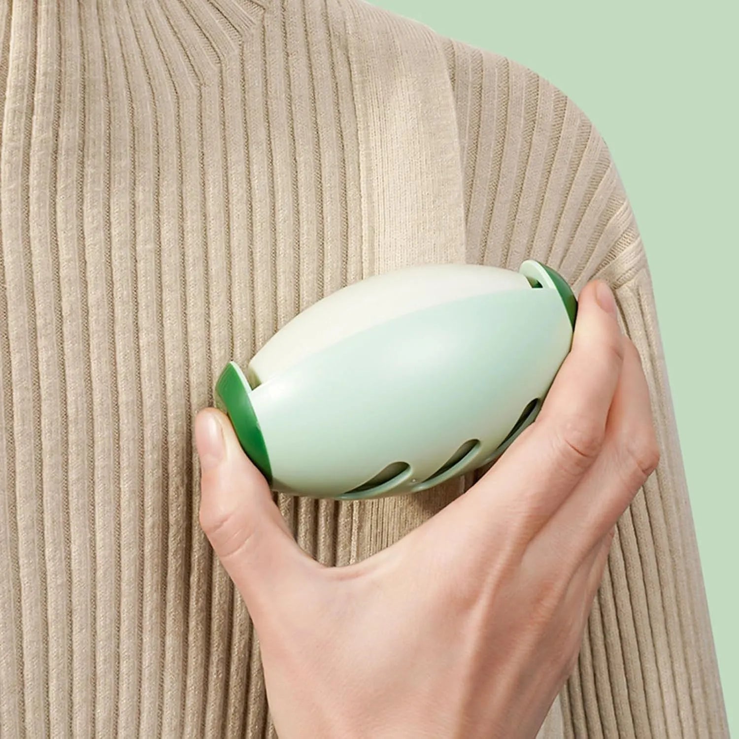 Green washable gel lint roller ball for pet hair removal from clothes and furniture