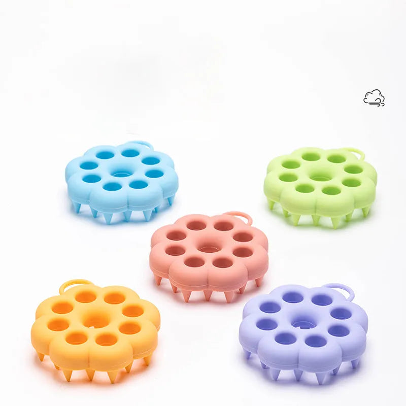 Silicone pet grooming brush with ergonomic handle shown in blue, for washing and brushing dogs and cats.