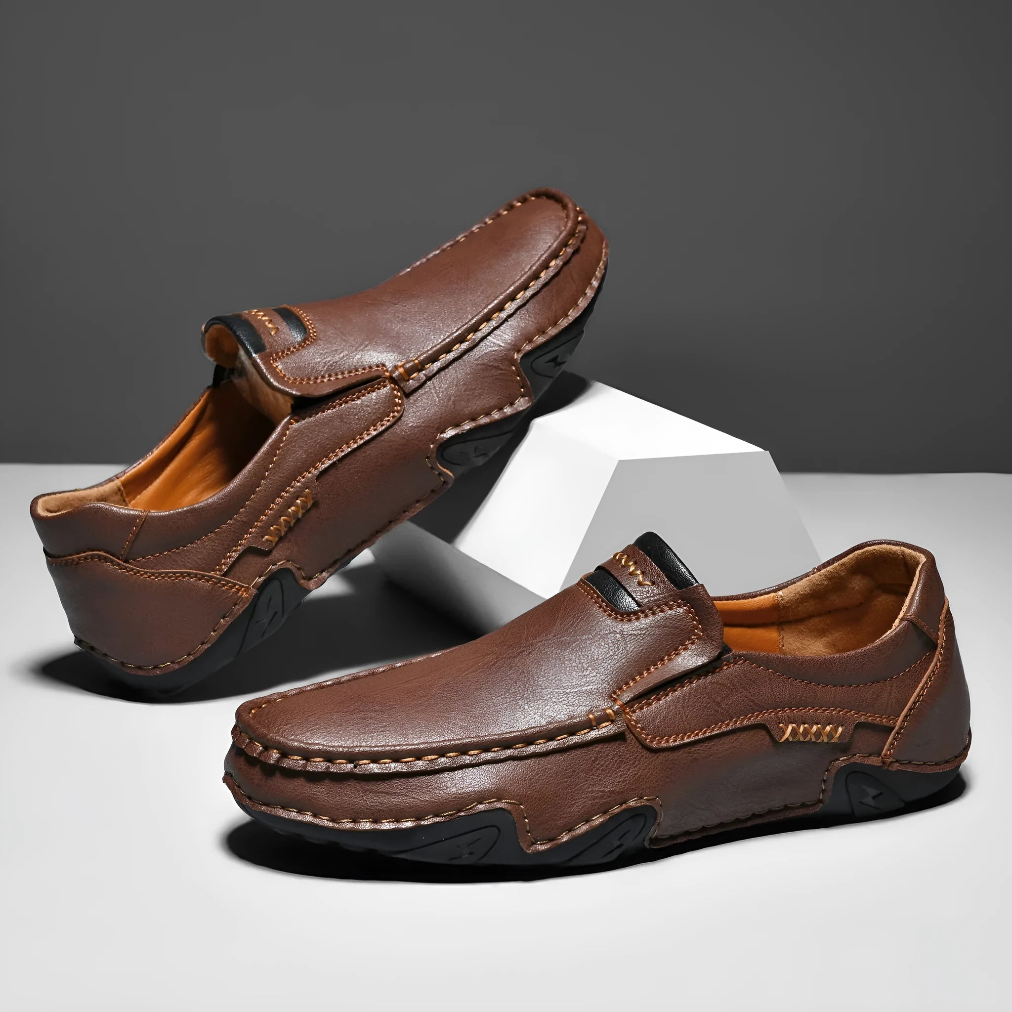 Men's leather slip-on casual shoes with round toe and flat rubber sole in four colour options