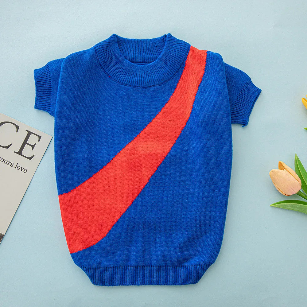 A corgi or poodle wearing a soft wool jumper in a choice of six colours including light green and orange red.
