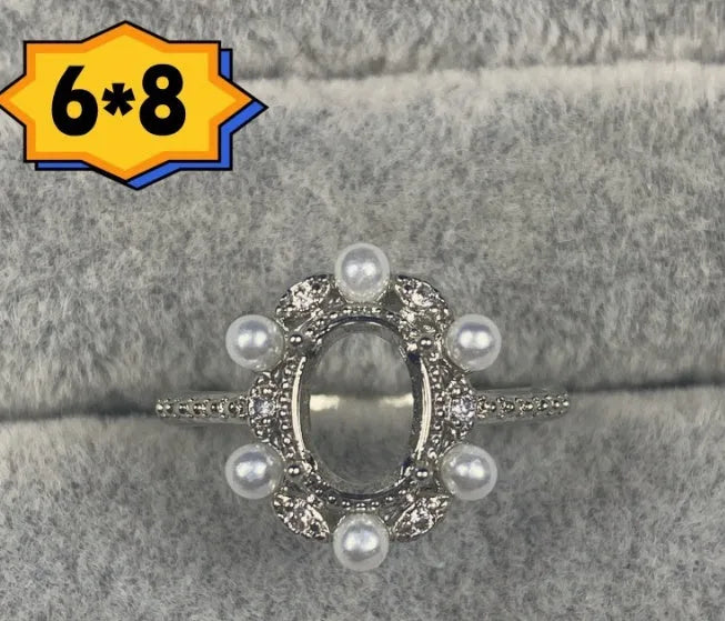 Oval denier ring with 6x8mm stone and five-pointed star detail on electroplated copper band