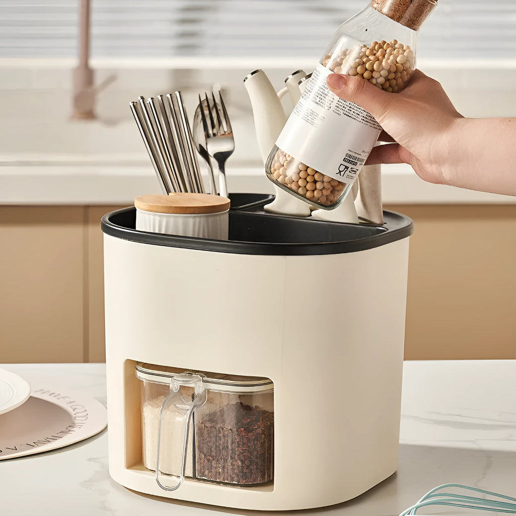 White rotating kitchen storage bucket with attached four-compartment spice box for utensils and seasonings.