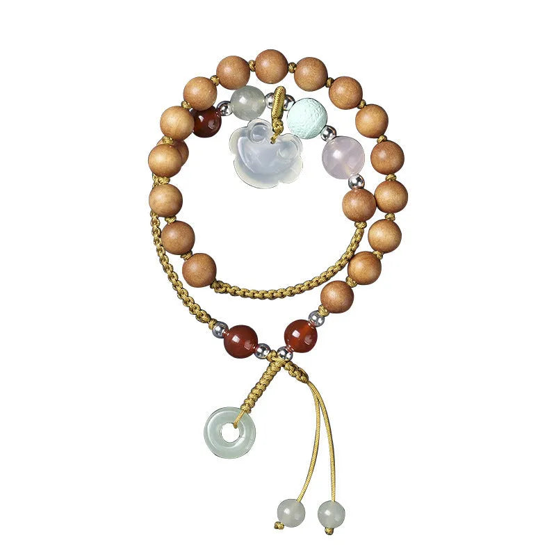 Hand-woven ebony double ring bracelet with ruyi elements in jade or chalcedony colour options