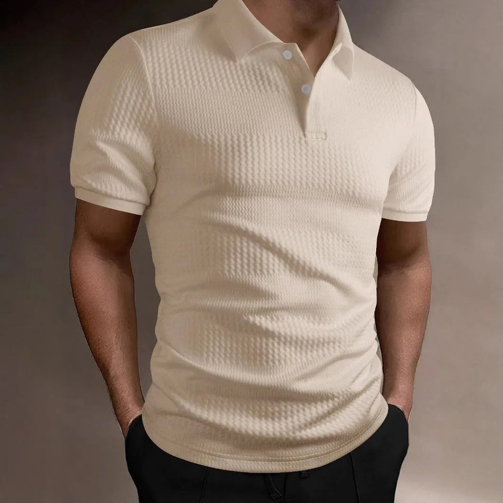 Man wearing a striped loose-fit polo shirt in light blue, showing short sleeves and asymmetric detail.