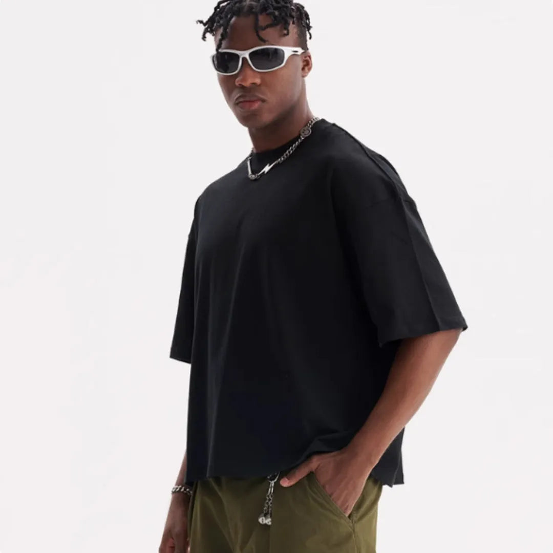 Men's loose fit pure cotton t-shirt in apricot colour on a hanger, showing short sleeves and casual style.