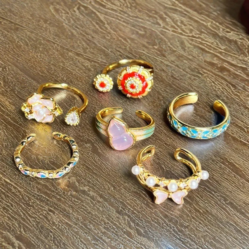 Adjustable copper gourd ring with inlaid zircon stones in New Chinese style featuring floral and bow designs