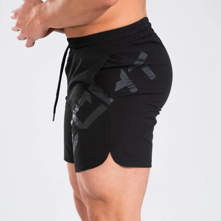 Men's black elastic knee-length training shorts with quick-drying fabric