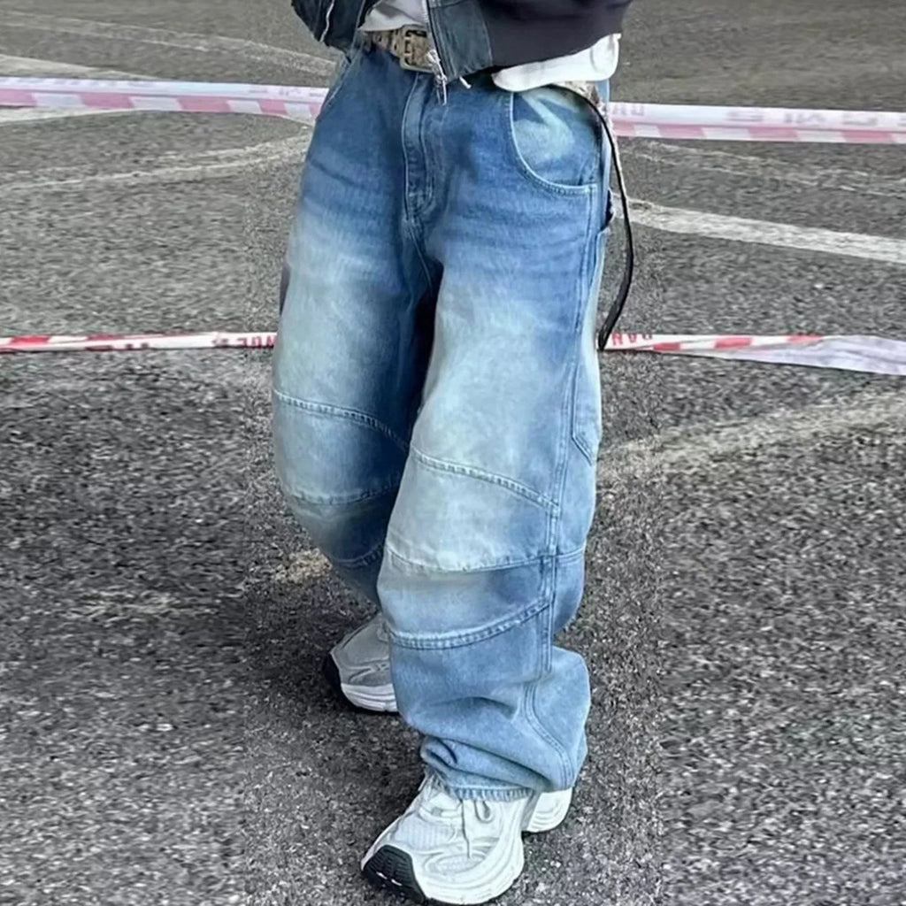 Baggy washed blue straight-leg jeans with zip fly on mannequin