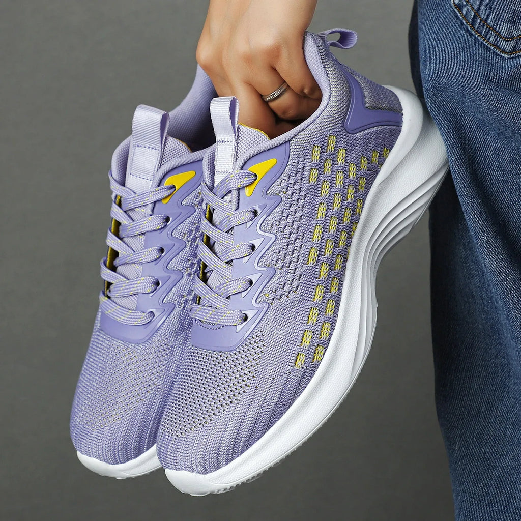 Women's lavender purple running shoes with mesh upper and EVA sole for sports.
