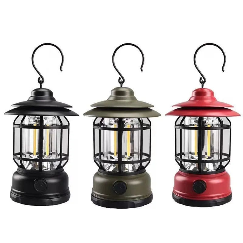 Dark green portable camping lantern with head lamp function on a table