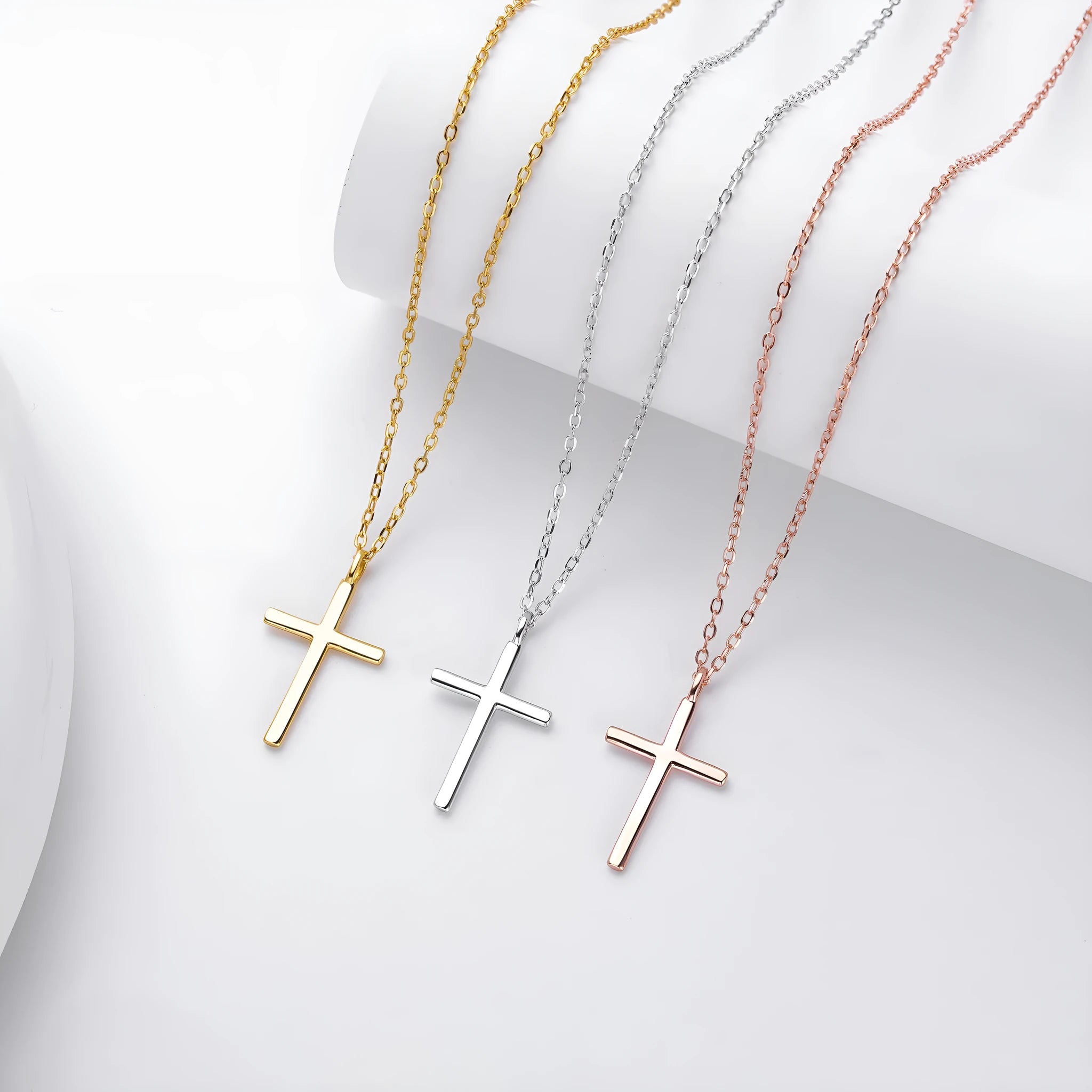S925 sterling silver necklace with glossy cross pendant on an adjustable O-chain in gold, platinum, or rose gold finish.