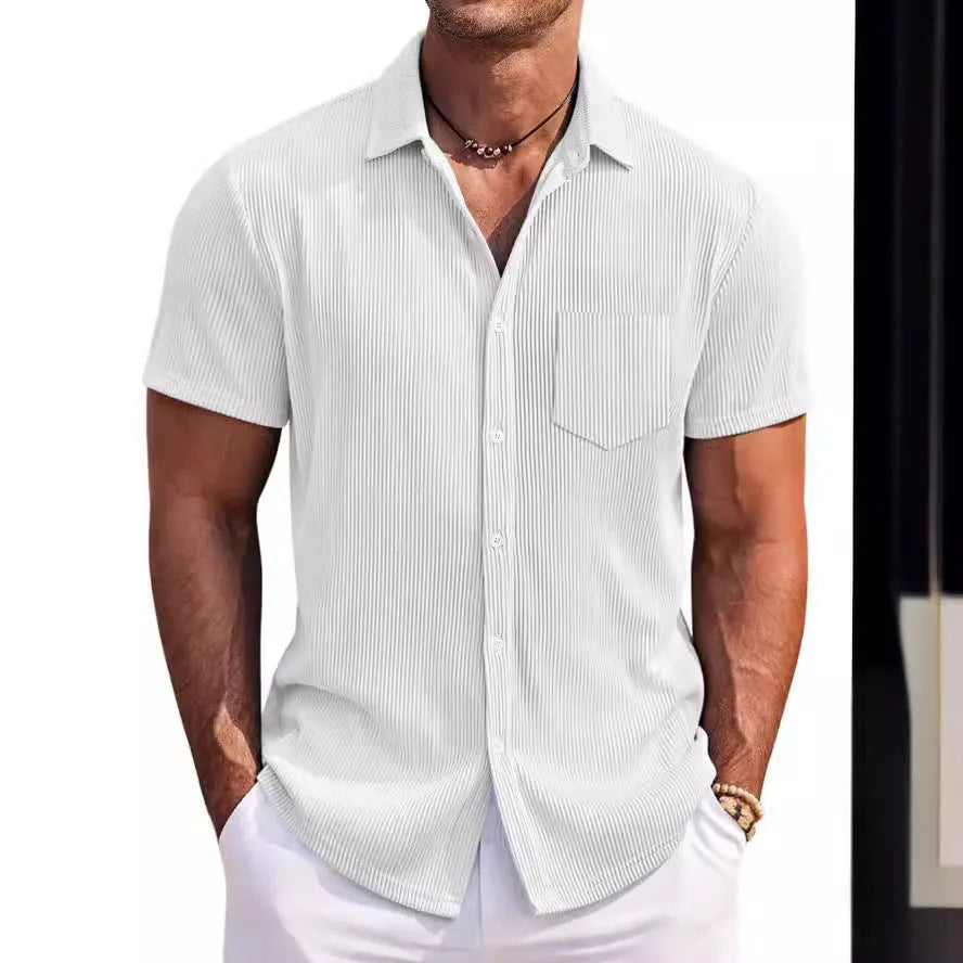 Men's solid colour loose fit short-sleeved polyester shirt on a hanger, showing the young casual style.