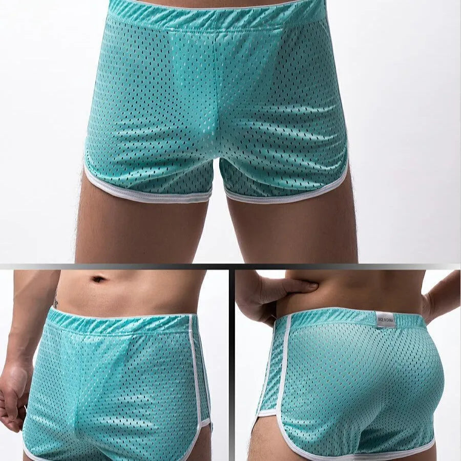 Men's black three-point boxer shorts on a white background showing mid-waist design.