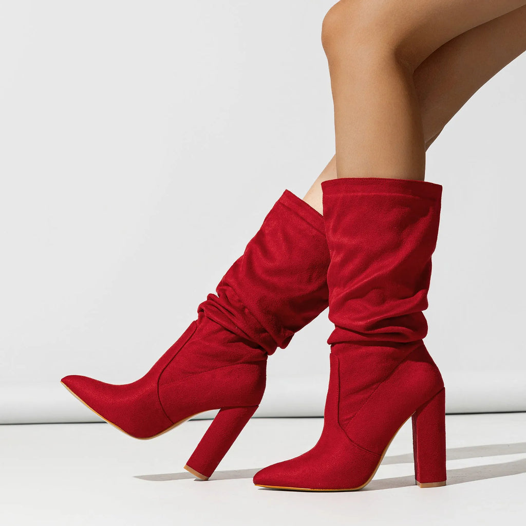 Women's black suede ankle boots with chunky high heel and pointed toe design
