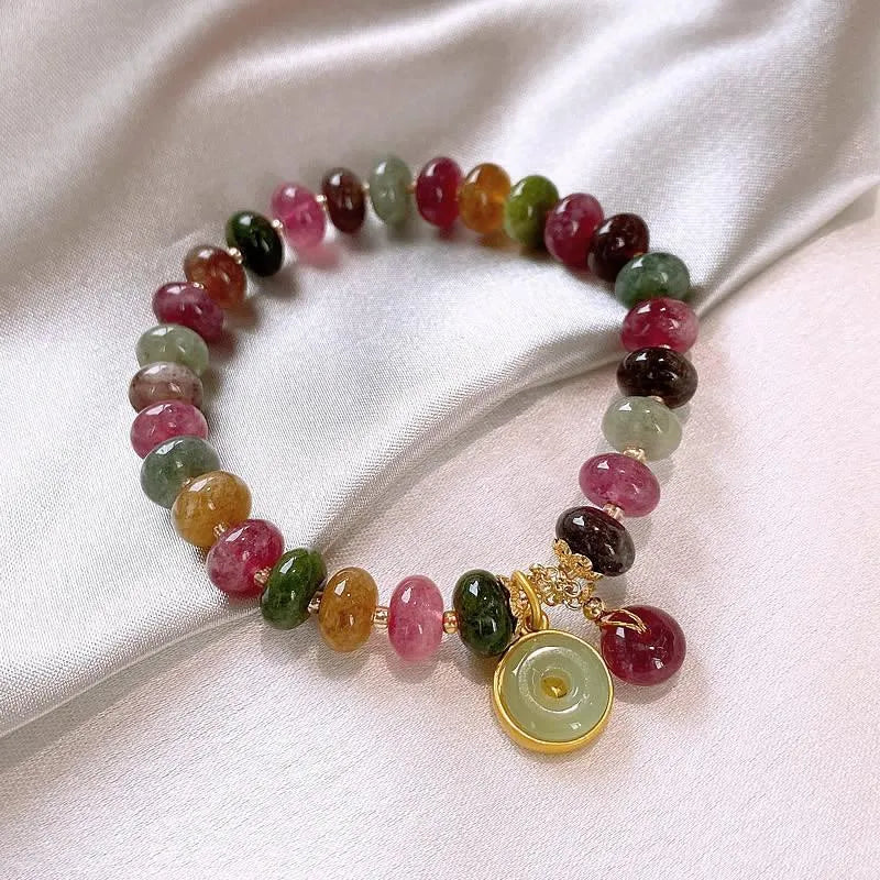 Handmade colourful tourmaline abacus bracelet with rabbit pendant charm on wrist