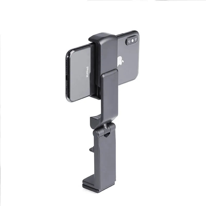 Black 360-degree rotating collapsible phone holder on desktop showing adjustable viewing angles