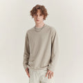 Men's loose-fit long-sleeved casual T-shirt in a solid colour with a round neck.