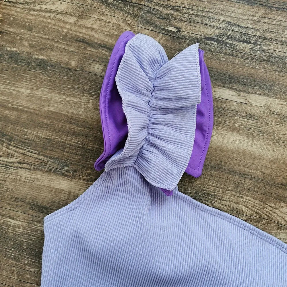Women's single-shoulder suspender tube top one-piece swimsuit in a solid colour with a high-waist design.