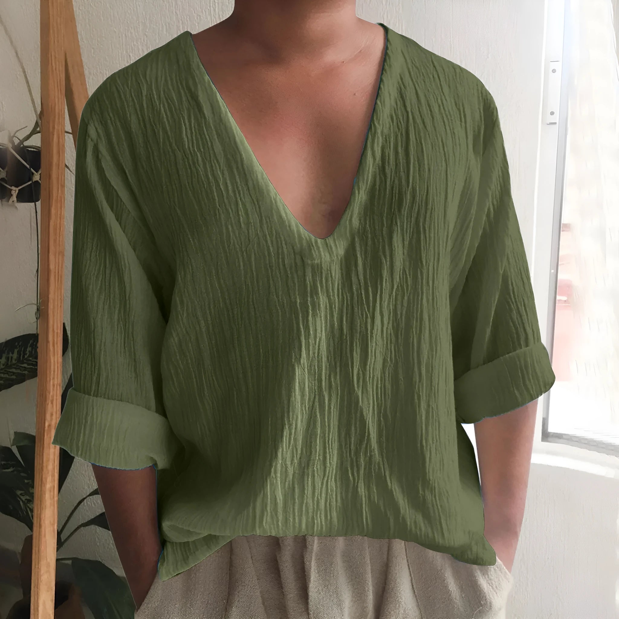 Men's long sleeve V-neck T-shirt in washed cotton fabric, shown in a solid colour.