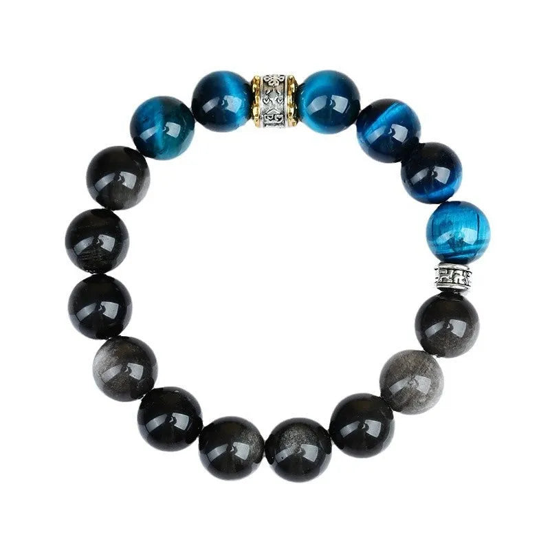 Handmade geometric Peacock Blue Tigereye stone bracelet with round beads on a wrist.