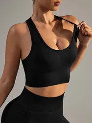 Black women's cross-back sports bra with moulded cups on a mannequin.