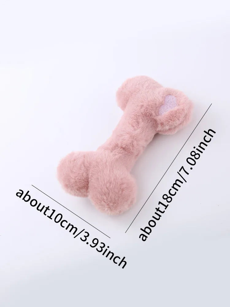 Blue squeaky plush love bone dog toy on a white background
