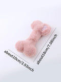Blue squeaky plush love bone dog toy on a white background