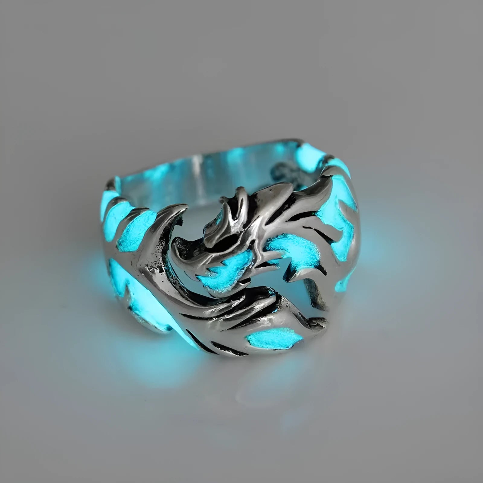 Adjustable metal ring with a luminous Chinese dragon pattern in antique silver blue and green.
