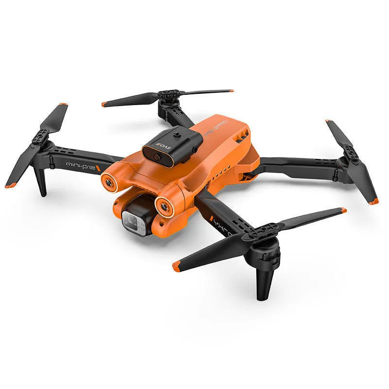 Black P12 foldable quadcopter drone with four propellers and a front-mounted HD camera on a grey surface