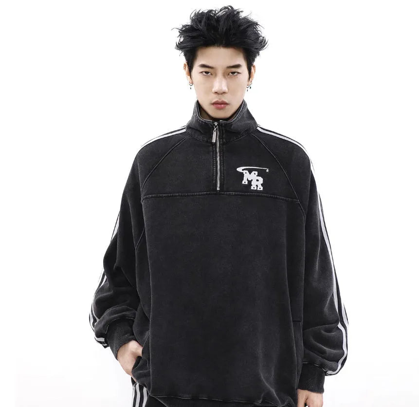 Black Hong Kong style men's polyester hoodie coat with stand collar and long sleeves.