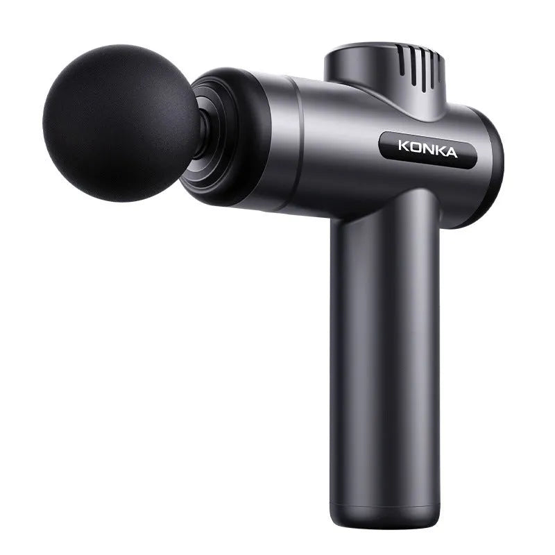 Konka V19 grey mini massage gun with multiple massage heads on a table.