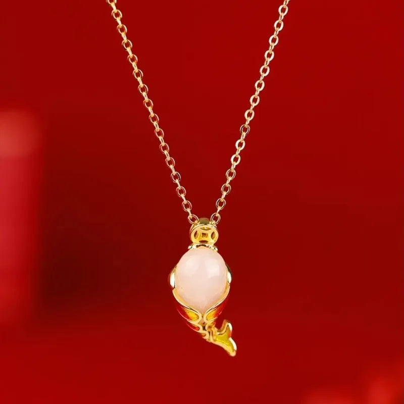 Lucky koi red copper carp literary necklace and retro bracelet on a white background.