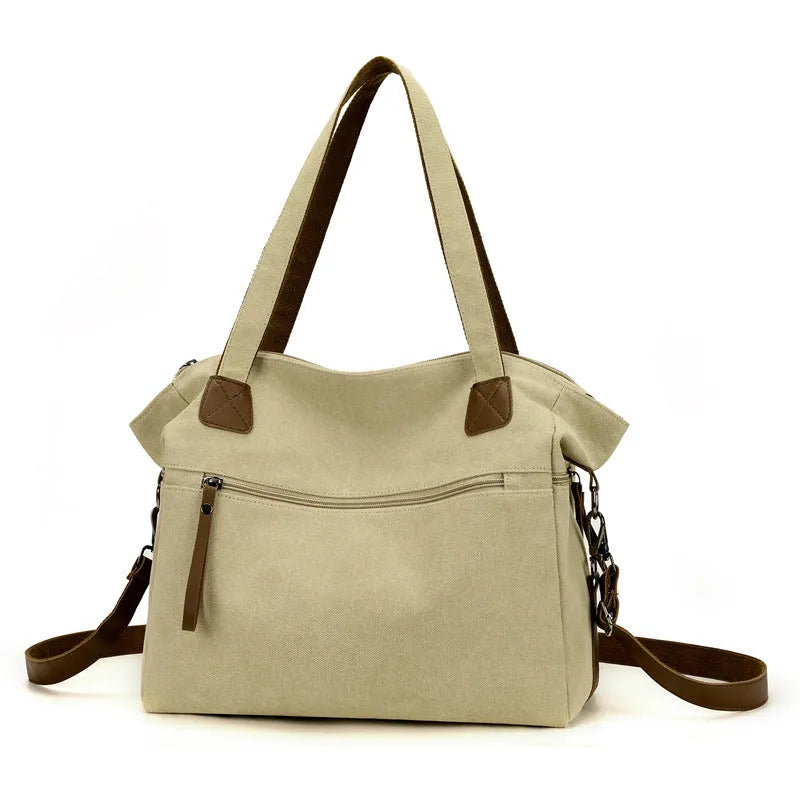 Retro style soft canvas shoulder bag for women in a horizontal square shape with internal organisers.