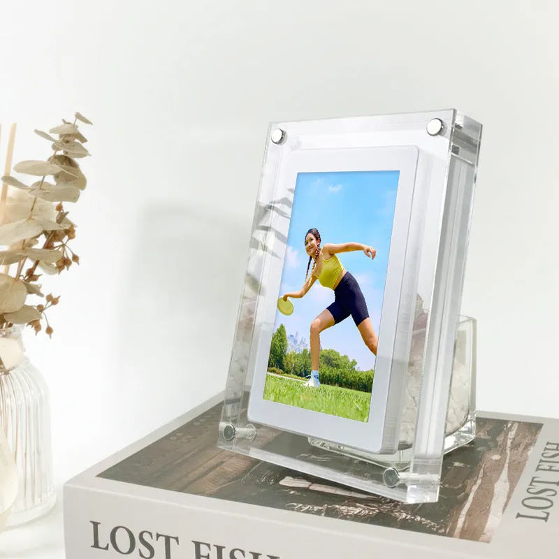 White acrylic digital picture frame showing family photos on a 5-inch vertical screen