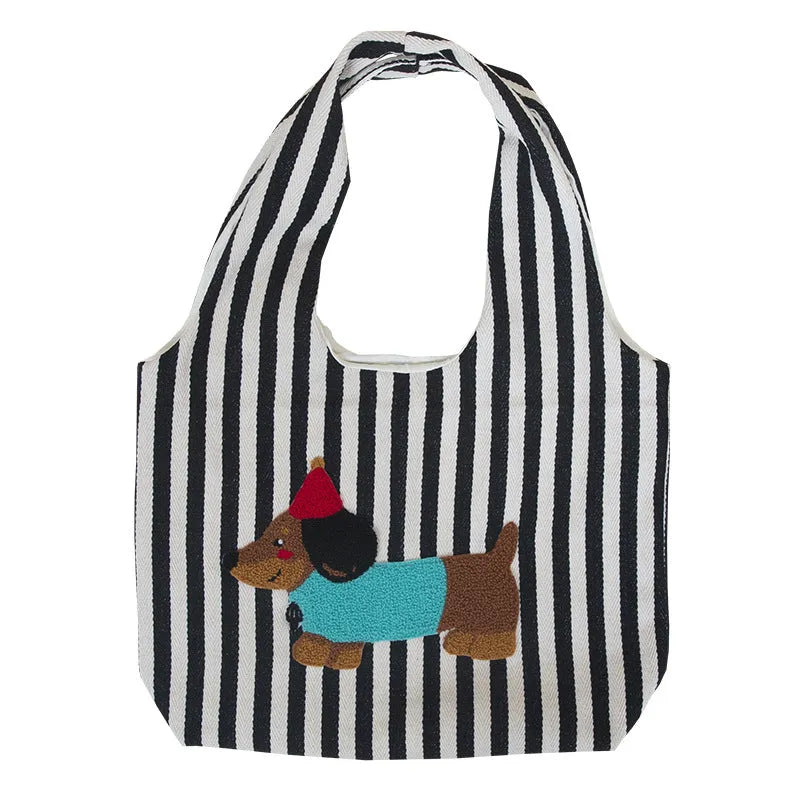 Soft canvas shoulder bag with red stripes and cartoon embroidery of a puppy wearing a red hat, square vertical shape, double shoulder straps