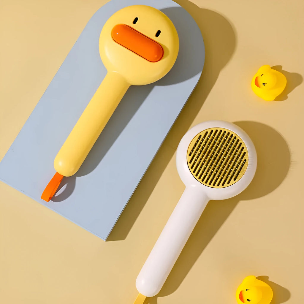 Small yellow duck comb for cat and dog hair removal with open section design