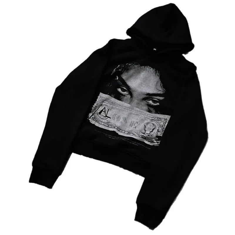 Women's black hoodie with a cartoon pattern print, loose fit.